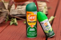 Two cans of OFF Deep Woods bug spray on picnic table